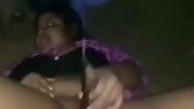 Nude desi lady fucks her hairy pussy with a brinjal